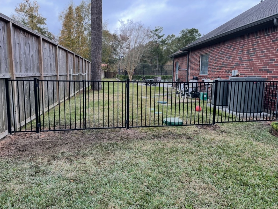 Professional wood fence installation by Premier Land Solutions